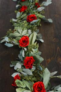 A beautiful Seeded Eucalyptus Garland Red Single Stem made by wedding florist, Something Borrowed Blooms, located near Lafayette, Louisiana.